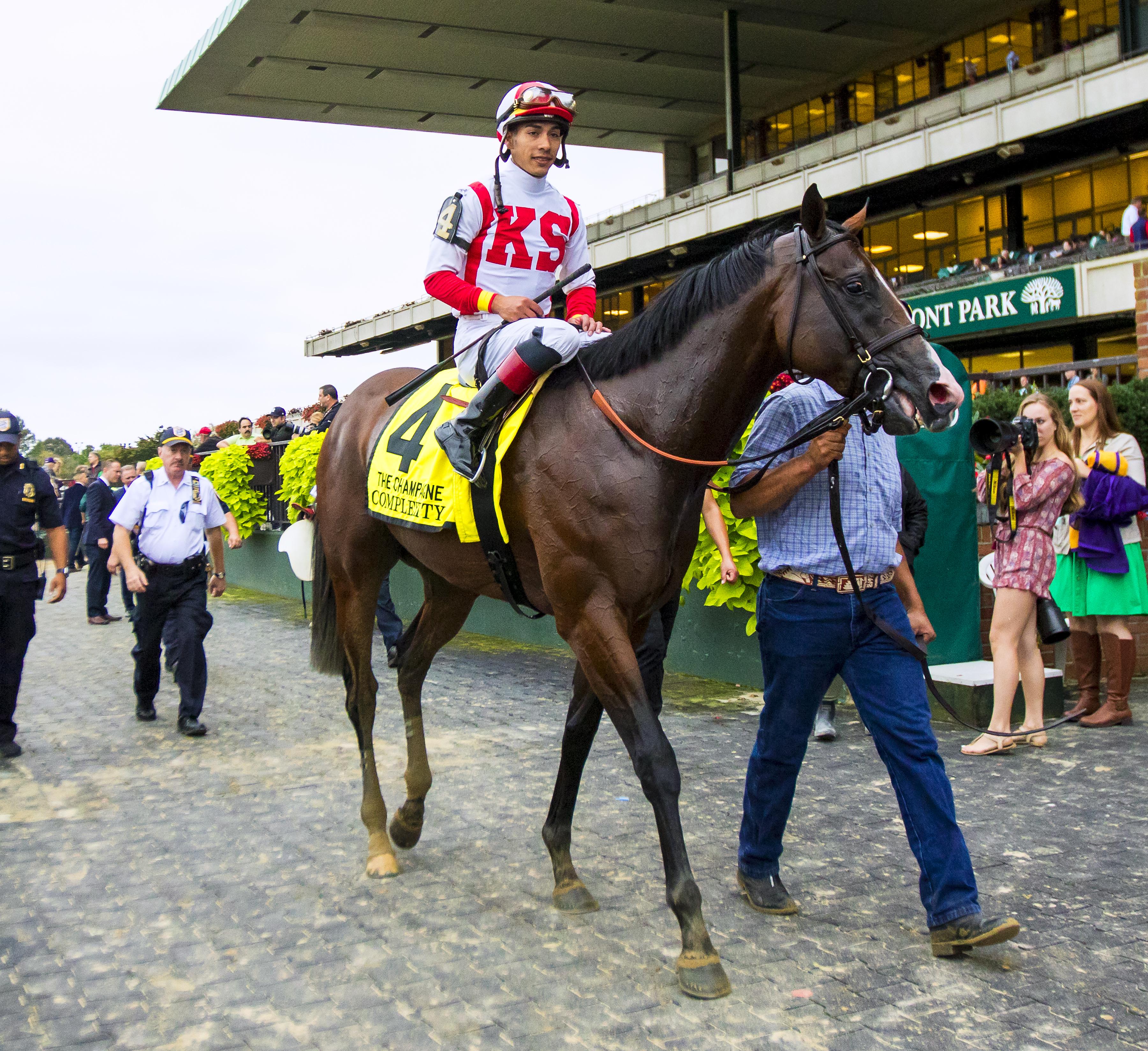 Ortiz and Complexity after winning the Champagne Stakes