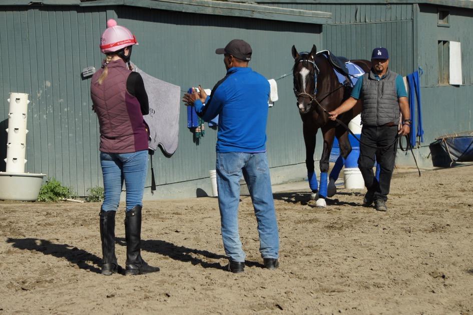Erin getting some pointers from Cisco Alvarado with Paradise Woods in the background.