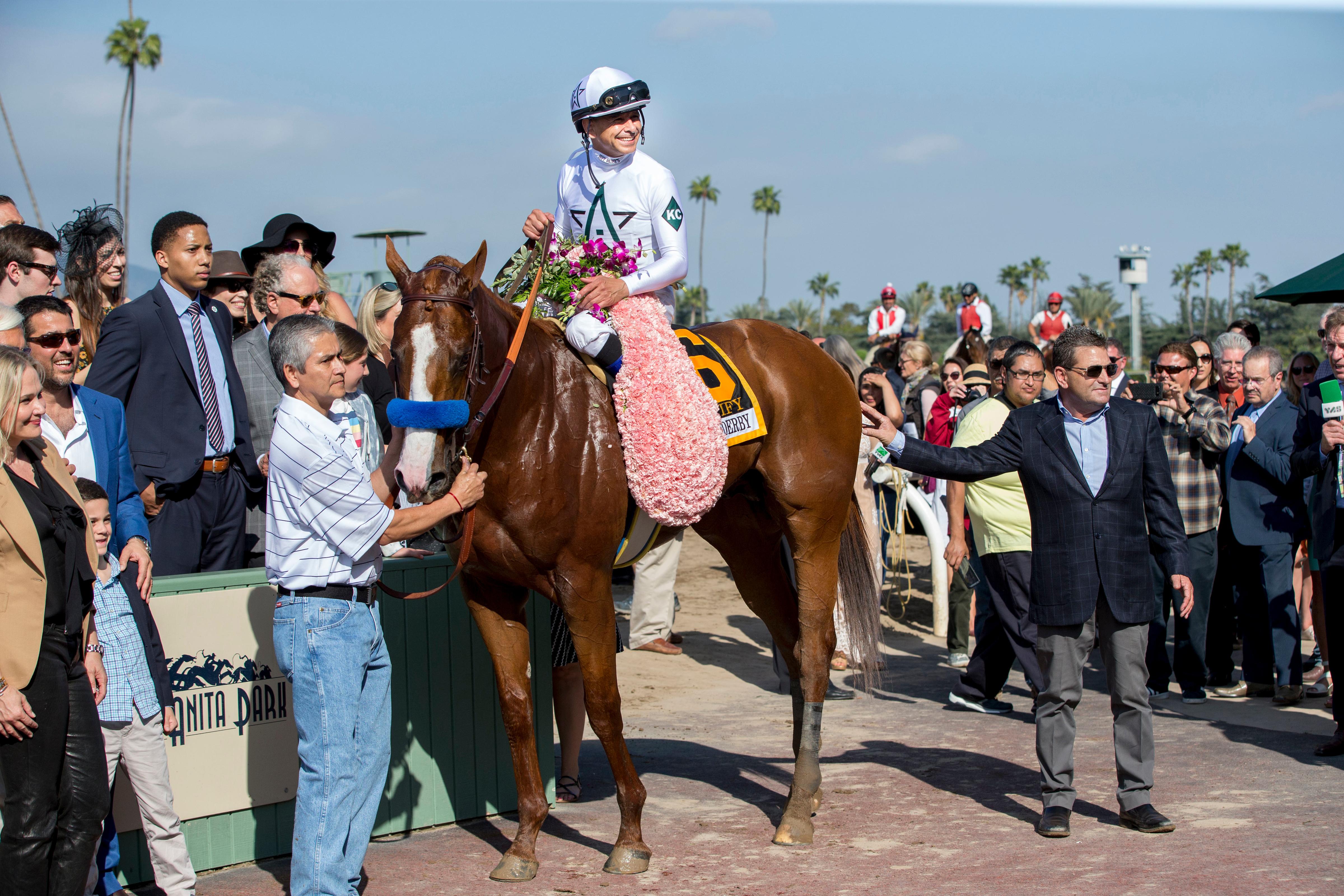 Justify and connections in the Santa Anita Derby winner's circle. (Eclipse Sportswire) Justify and connections in the Santa Anita Derby winner's circle.