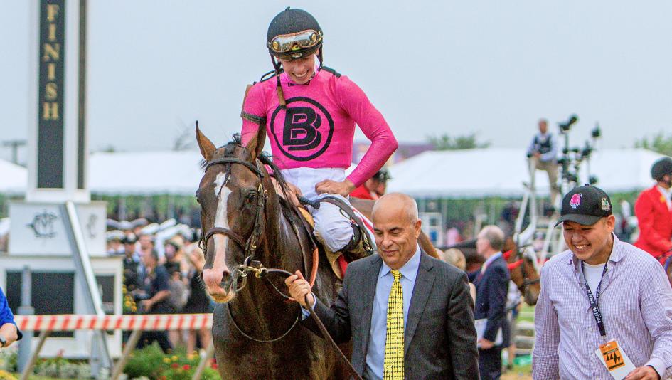 Trainer Mark Casse, pictured leading the horse, will race Preakness winner War of Will in Saturday's Belmont Stakes.