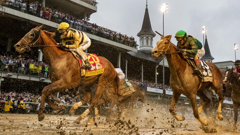 Country House strides through the slop at Churchill Downs to win the Kentucky Derby.