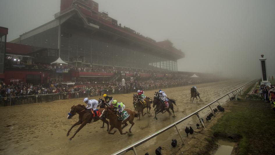 Justify captures a rainy, foggy edition of the Preakness Stakes at Pimlico.
