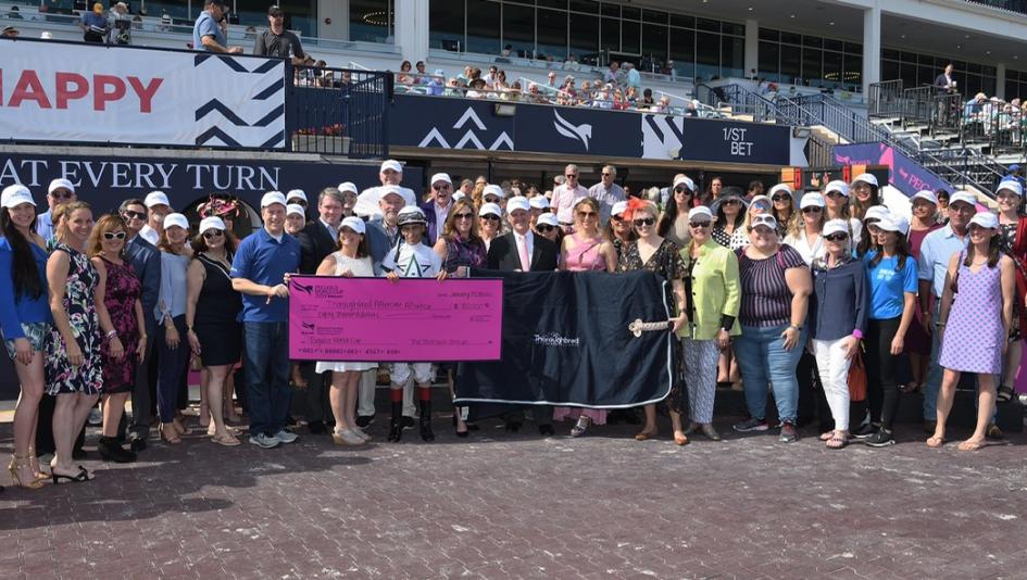 The Thoroughbred Aftercare Alliance and accredited organizations accept a check from Gulfstream Park.