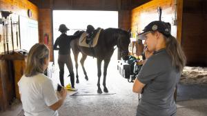 Suzie Oldham (left) inspects the Maker's Mark Secretariat Center for the Thoroughbred Aftercare Alliance. 